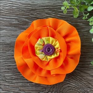 Orange Flower Hair Clip with Yellow Center and Purple Button